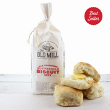Bag of The Old Mill buttermilk biscuit mix with biscuits on a white background